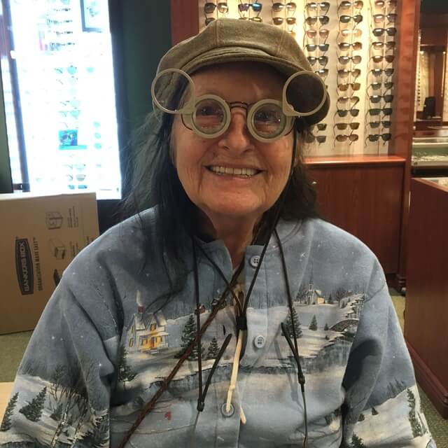 senior woman wearing low vision glasses